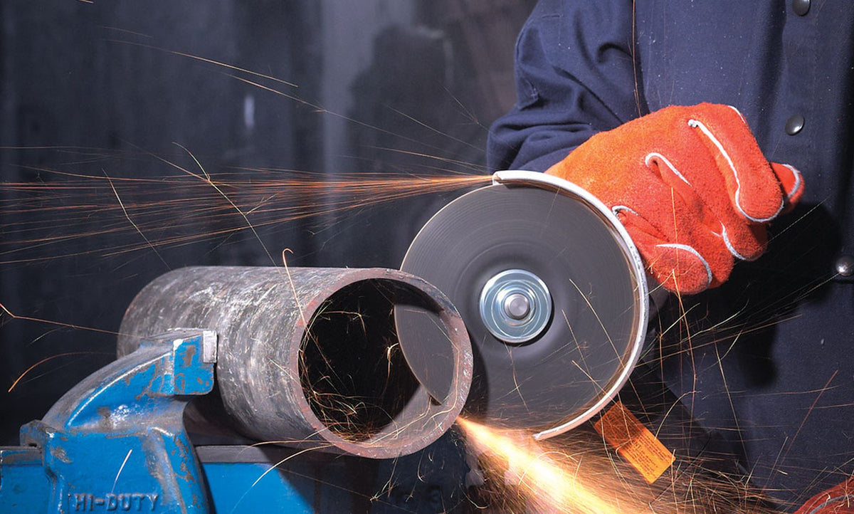 Walter COMBO ZIP wheel on an angle grinder cutting steel pipe